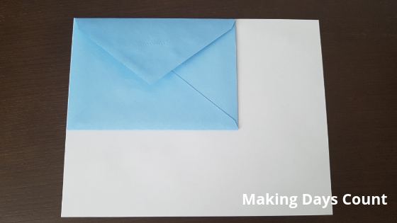 Measure envelope against white paper