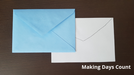 Cutting the white paper to match the envelope