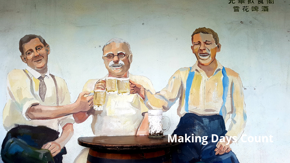 Mural of 3 men drinking 