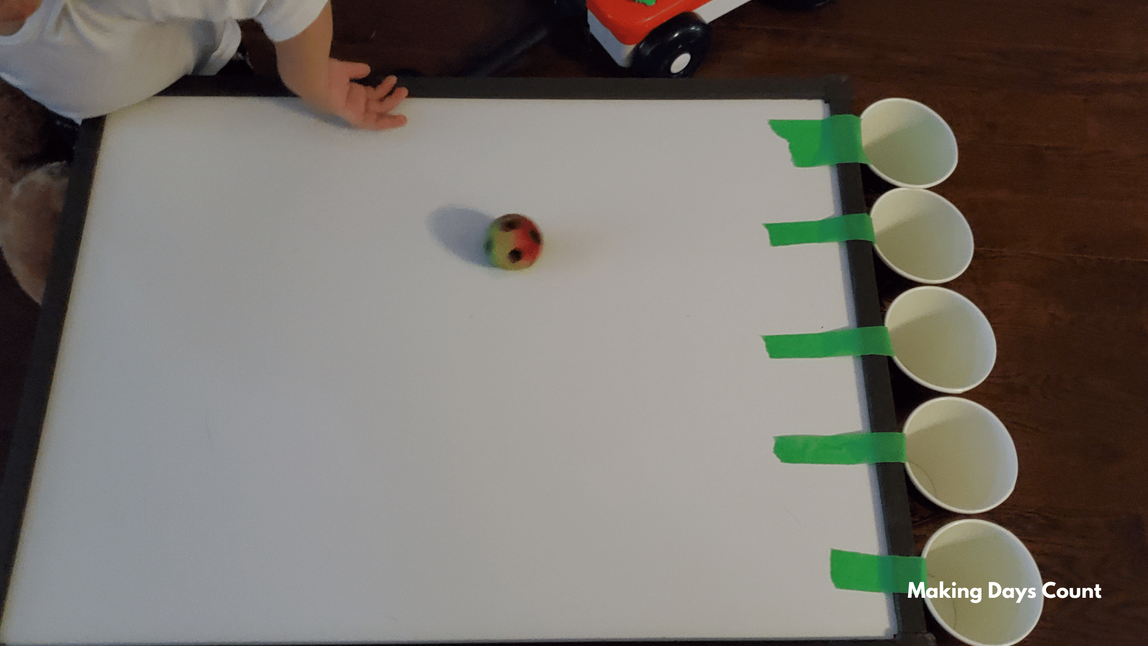 Indoor Toddler Activities: Cups and a Ball